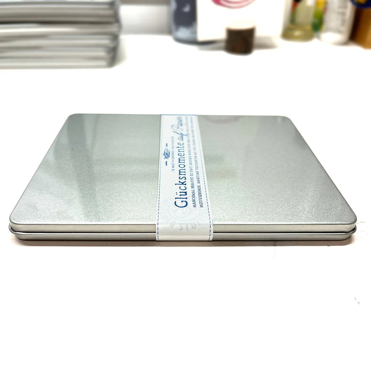 Metalldose Glücksmomente auf Papier mit Banderole, Postkarten-Set geschlossen | Prinzenart